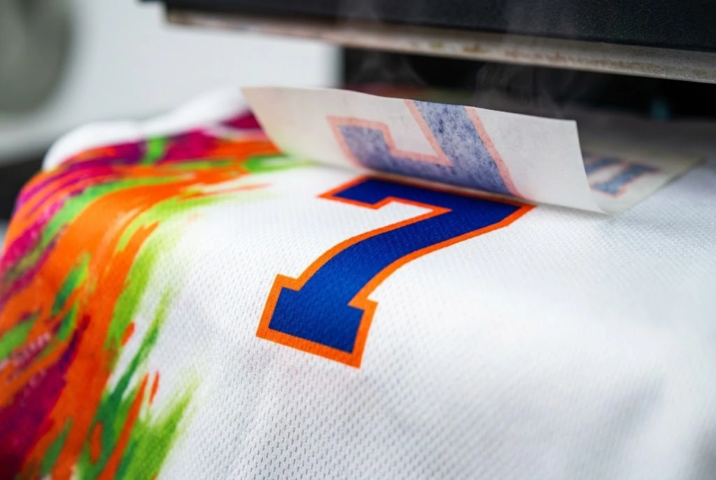 close-up of high-definition dye-sublimation printing applied to blank soccer apparel for custom retail orders.